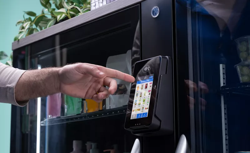 Person selecting goods at fridge cabinet