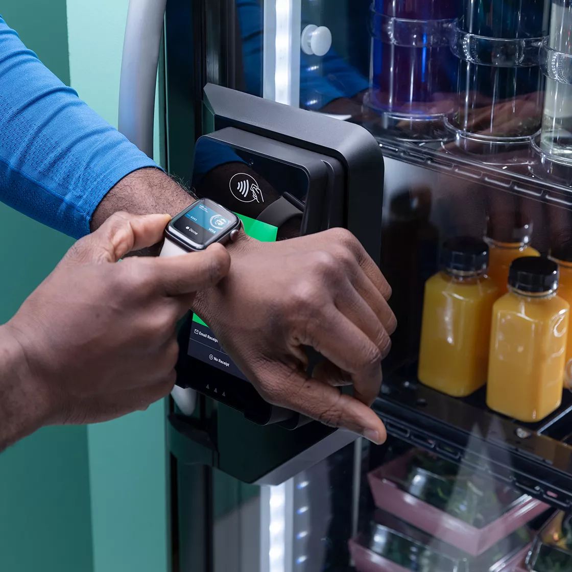 Man purchasing goods with Apple Watch