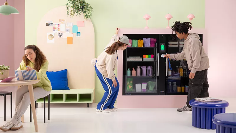 Students looking in vending cabinet