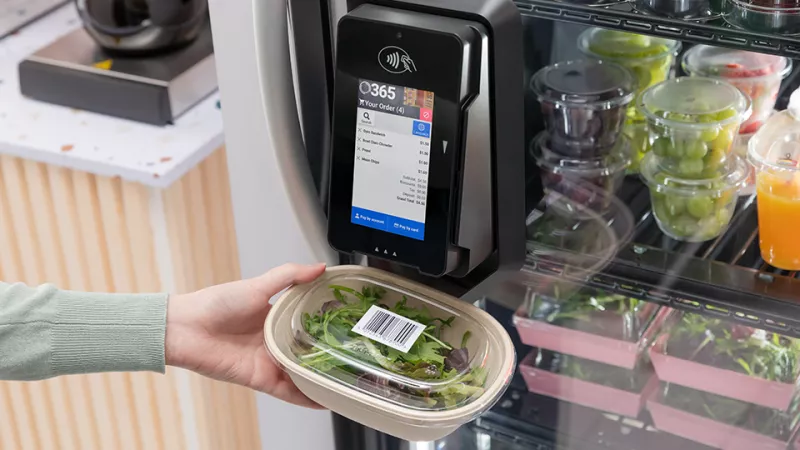 Scanning salad at vending machiene