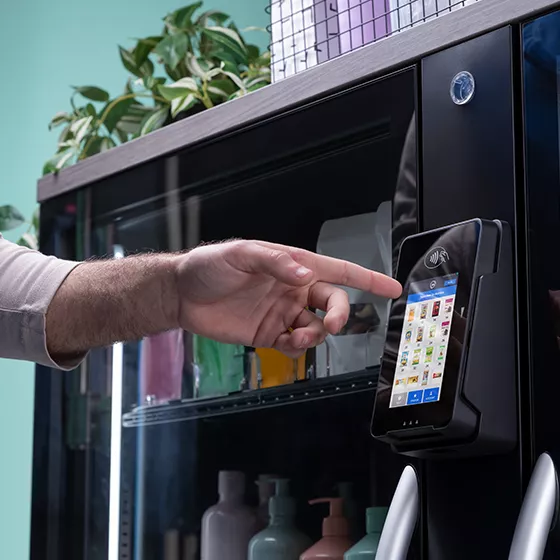 User selecting products on payment kiosk to purchase