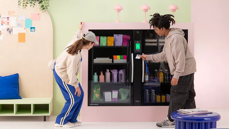 Students unlocking vending machine with student card