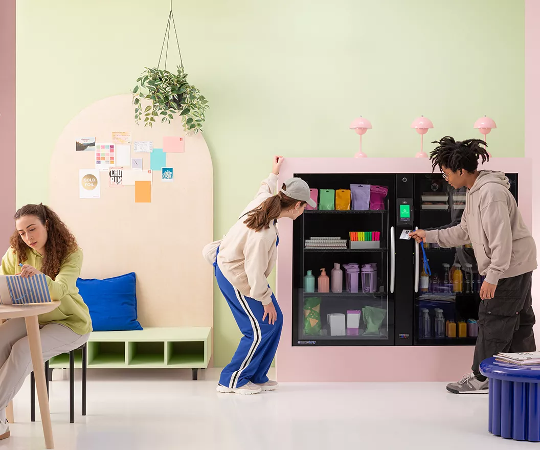 Students looking into vending machine