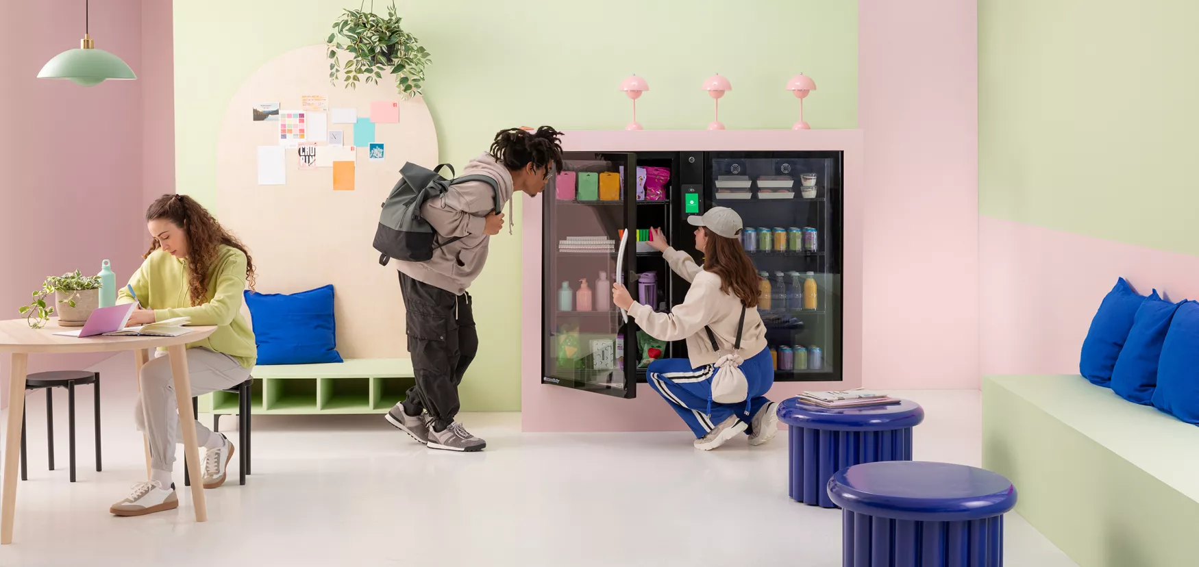 Collage students in study dorm getting supplies from vending machine