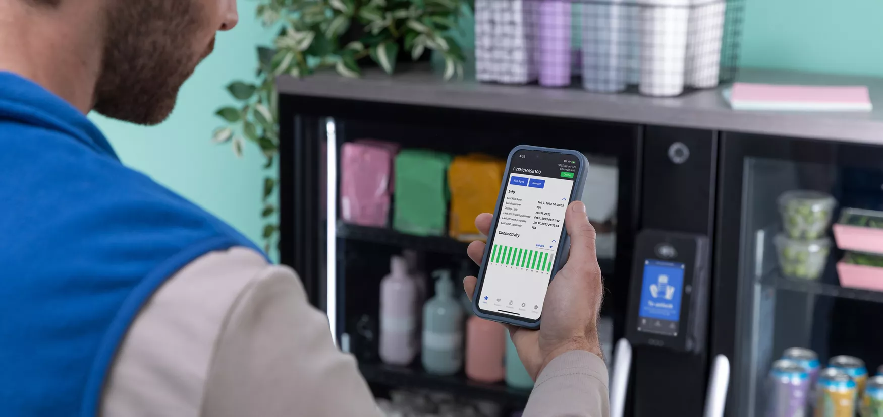 Operator looking at data and insights for vending machine