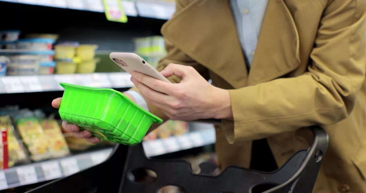 Women scanning barcode with phone